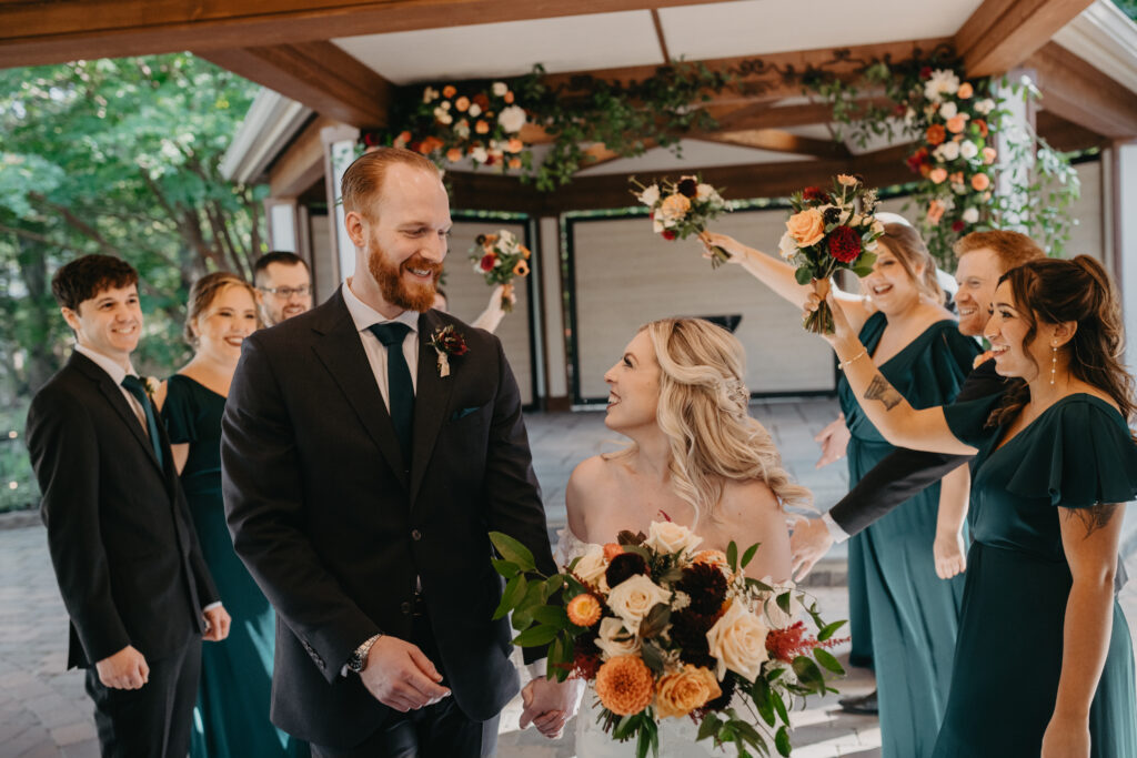 Scotland Run Golf Club wedding featuring fall flowers. Wedding bouquet with roses and dahlias