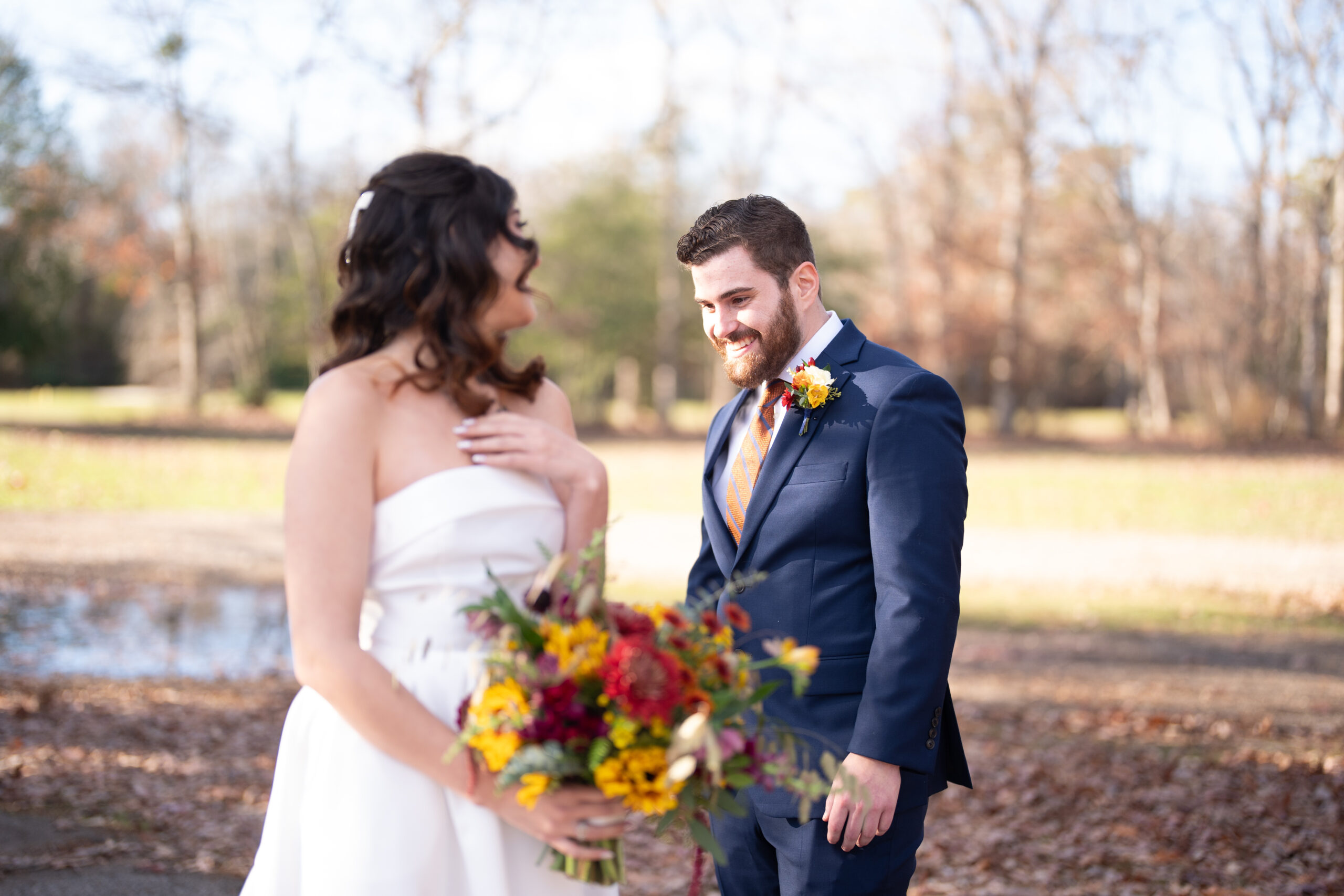 Beautiful fall wedding bouquet and matching boutonierre crafted by Leigh Florist for wedding at Grove at Centerton